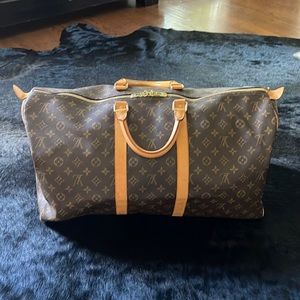 Louis Vuitton Vintage Monogram Keepall 55. Includes original dust bag and bonus.